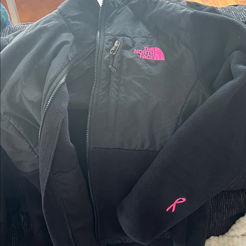 The North Face women’s Black and Pink fleece Jacket